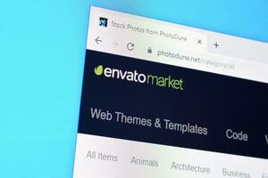 Homepage of envato market photodune website on the display of PC, url - photodune.net. photo