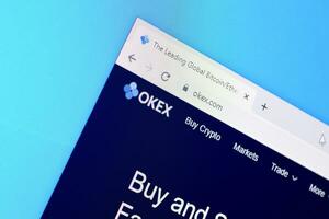 Homepage of okex website on the display of PC, url - okex.com. photo