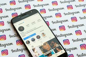 Zendaya official instagram account on smartphone screen on paper instagram banner. photo
