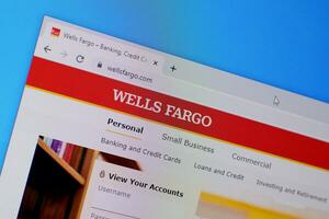 Homepage of wells fargo website on the display of PC, url - wellsfargo.com. photo