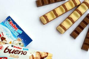 Kinder Chocolate small box for kids and bueno white chocolate bar made by Ferrero SpA. Kinder is a confectionery product brand line of multinational manufacturer Ferrero photo