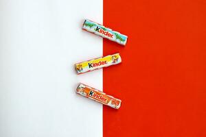 Kinder small Chocolate bars made by Ferrero SpA. Kinder is a confectionery product brand line of Italian multinational manufacturer Ferrero photo