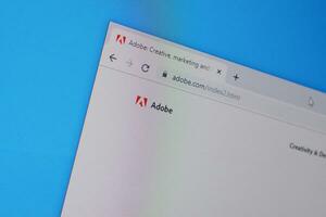 Homepage of adobe website on the display of PC, url - adobe.com. photo