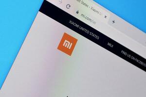 Homepage of xiaomi website on the display of PC, url - mi.com. photo