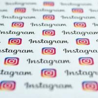 Instagram pattern printed on paper with small instagram logos and inscriptions. Instagram is American photo and video-sharing social networking service owned by Facebook