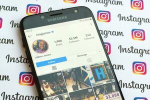 LeBron James official instagram account on smartphone screen on paper instagram banner. photo