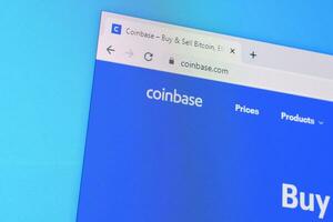 Homepage of coinbase website on the display of PC, url - coinbase.com. photo