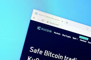 Homepage of kucoin website on the display of PC, url - kucoin.com. photo