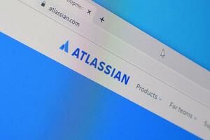 Homepage of atlassian website on the display of PC, url - atlassian.com. photo