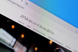 Homepage of jp morgan chase website on the display of PC, url - jpmorganchase.com. photo