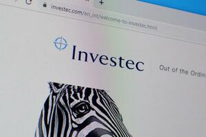 Homepage of investec website on the display of PC, url - investec.com. photo