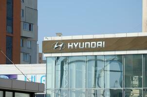 KHARKOV, UKRAINE - OCTOBER 20, 2019 Logotype of Hyundai corporation over blue Sky. Hyundai is South Korea automotive manufacturer photo