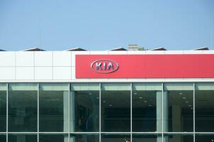 KHARKOV, UKRAINE - OCTOBER 20, 2019 Kia Automobile shop Dealership car logo Store sign. Kia Motors is South Korea automobile manufacturer photo