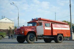 KHARKOV, UKRAINE - OCTOBER 25, 2019 Fire rescue truck from post soviet era parks on main Kharkiv city freedom square photo