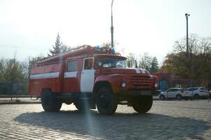 KHARKOV, UKRAINE - OCTOBER 25, 2019 Fire rescue truck from post soviet era parks on main Kharkiv city freedom square photo