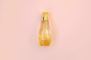 KHARKOV, UKRAINE - OCTOBER 21, 2019 Bottle of So Elixir perfume by Yves Rocher on bright pink color background photo