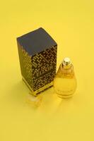 KHARKOV, UKRAINE - OCTOBER 21, 2019 Bottle of So Elixir perfume by Yves Rocher on bright yellow color background photo