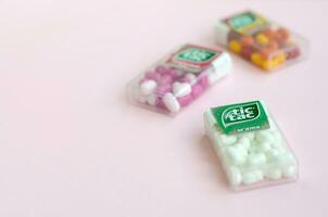 Many Tic Tac Candy packages close up. Tic tac is popular due its minty fresh taste and easy to carry. Hard mints produced by Ferrero since 1968 photo