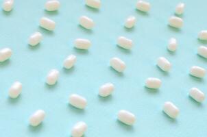 Tic tac hard mints pattern close up. Tic tac is popular due its minty fresh taste and easy to carry. Hard mints produced by Ferrero since 1968 photo