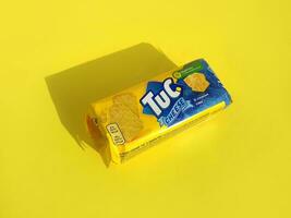 Tuc snack pack on bright yellow flat background photo