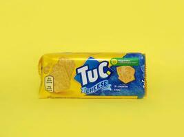 Tuc snack pack on bright yellow flat background photo