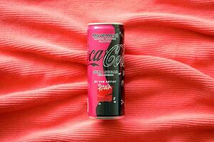 KYIV, UKRAINE - JULY 7, 2023 Coca-Cola zero sugar can with Rosalia design limited edition on red background photo