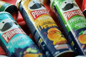 KYIV, UKRAINE - JULY 7, 2023 Pringles passport edition chips cans with different flavour photo