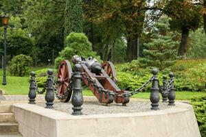 LVIV, UKRAINE - SEPTEMBER 11, 2022 A picturesque landscaped garden at the citadel in Lviv. Fortification defensive brick building of the Middle Ages photo