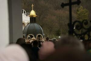 TERNOPIL, UKRAINE - APRIL 2, 2023 Many people during mission in complex of Ukrainian Jerusalem in the Mari spiritual center of Zarvanytsia In the Terebovlya district of the Ternopil photo