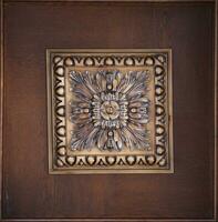 Elegant dark brown ceiling with stone patterns and a rosette texture photo