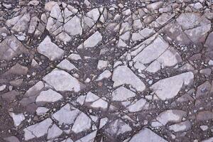 Background of shattered stony stones surface in mountain area. Texture with natural light photo