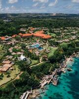 Bali on the coast Natural and Architectural Views from the Air,Aerial view of coastal Bali combining architecture and nature by the sea. photo