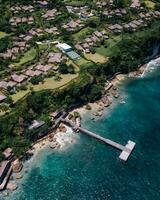 Aerial View of Bali City and Coastal Views,Captivating aerial view of coastal Bali cityscape blending with natural beaches and ocean. photo