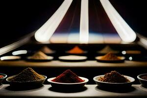 a row of bowls with different spices in them. AI-Generated photo