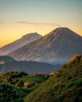 Tranquil Sunrise over Majestic Mountain Range,Breathtaking dawn majestic mountain range in tranquil non-urban countryside. Perfect for travel destinations. photo