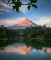 Tranquil Scene of Mountains Reflected in a Lake,Nature's beauty serene morning, lush green landscape, majestic mountains, pristine lake, tranquil scene. photo