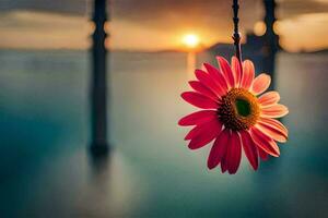a pink flower is hanging from a chain. AI-Generated photo