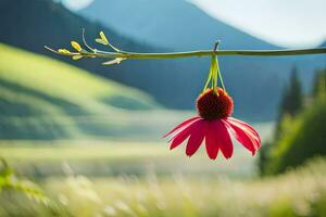 a red flower hanging from a branch in front of a mountain. AI-Generated photo