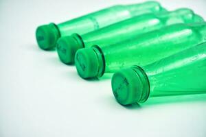 Green PET plastic bottle in white background photo