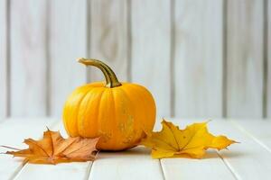 Decorative pumpkin background and dry autumn leaves on wooden arrangement indoors. Halloween concept by AI generated photo