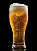 A glass of cold fresh beer with cap of foam. Splash of foam with tasty american beer. Beer day concept by AI Generated photo