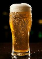 A glass of cold fresh beer with cap of foam. Splash of foam with tasty american beer. Beer day concept by AI Generated photo