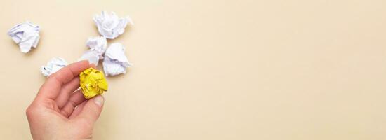 crumpled yellow and white paper as a concept creative idea and innovation photo