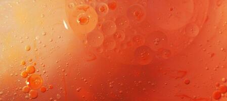 Gold and red Oil bubbles close up. circles of orange and pink water macro. abstract shiny background photo