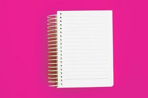 Top view of blank note paper on pink background photo