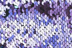 Purple abstract sequins sparkling background. Texture of sequins. photo