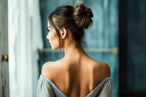 A beautiful bride with a bun hairstyles for long hair look from back. A female hairstyle rear view concept by AI Generated photo