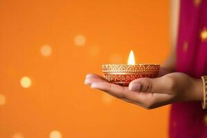 Happy diwali or deepavali traditional indian festival with clay diya oil lamp. Indian hindu festival of light symbol with candle and light. Clay diya lamp lit during diwali celebration by AI generated photo