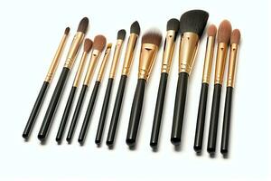 Set of professional makeup brushes cosmetic accessories set on white background. Makeup tool concept by AI Generated photo