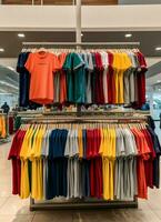 Row of fashionable polo t-shirts for man on wooden hanger or rack in a clothing boutique retail shop concept by AI Generated photo